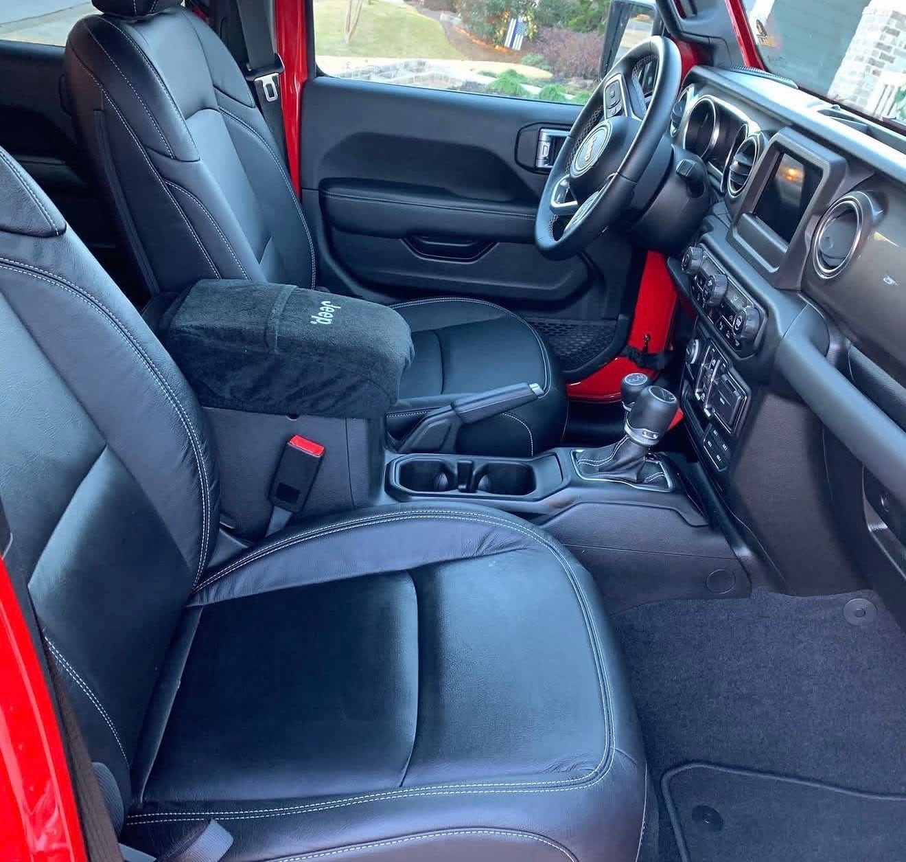 The cleaned and conditioned leather seats of a Jeep