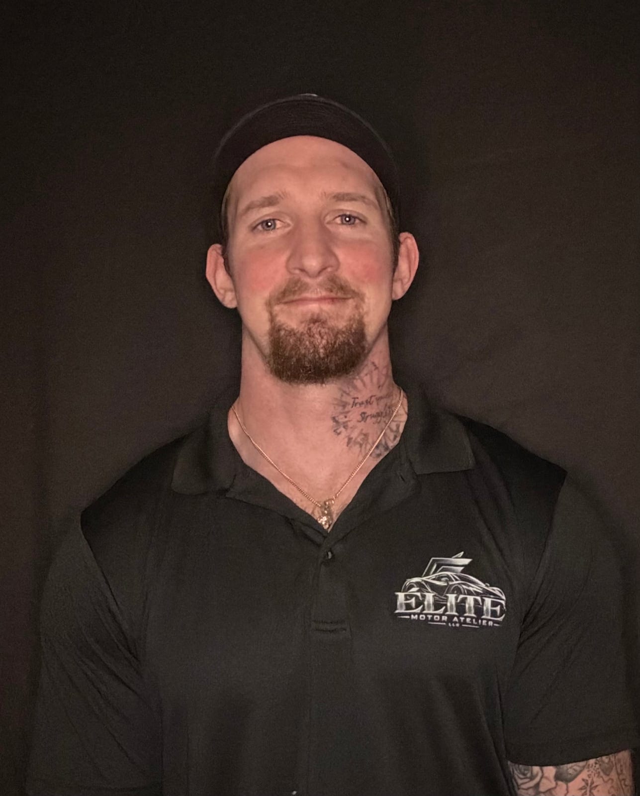 Rob Berry, co-founder of Élite Motor Atelier, in the company polo and cap